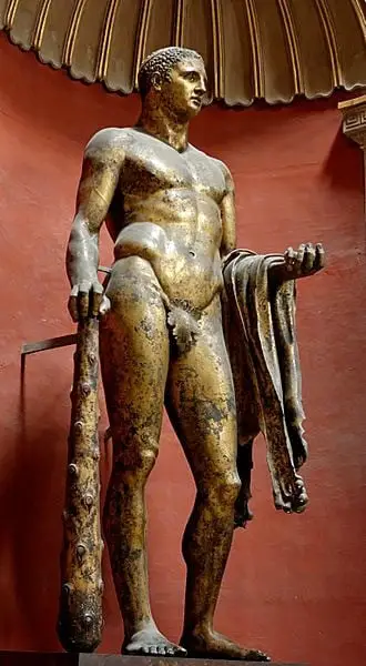 Legenda: Hércules, estátua romana em bronze. No braço, a pele do Leão da Nemeia.
