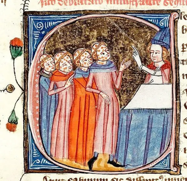 Legenda: Nesta iluminura medieval, um sacerdote abençoa vítimas da peste negra.